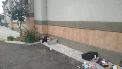 Homeless sleeping on a Ralphs parking lot