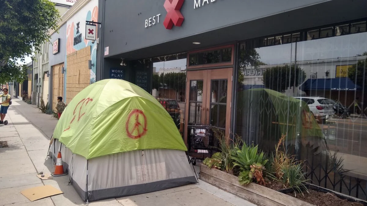 Homeless tent in front of a store